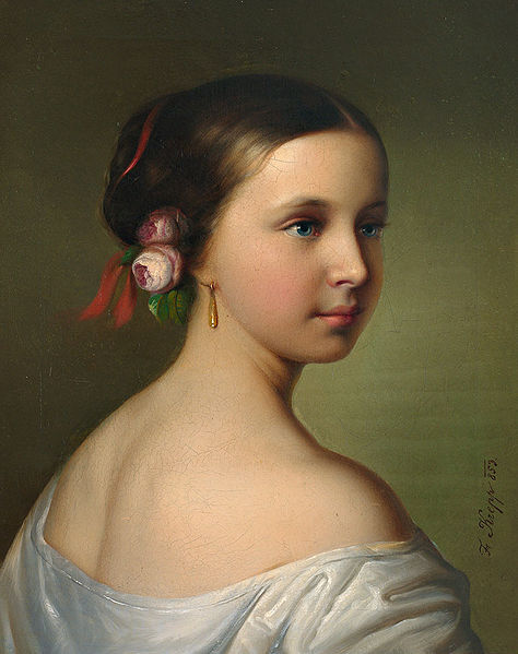 Portrait of a young woman with roses in her hair